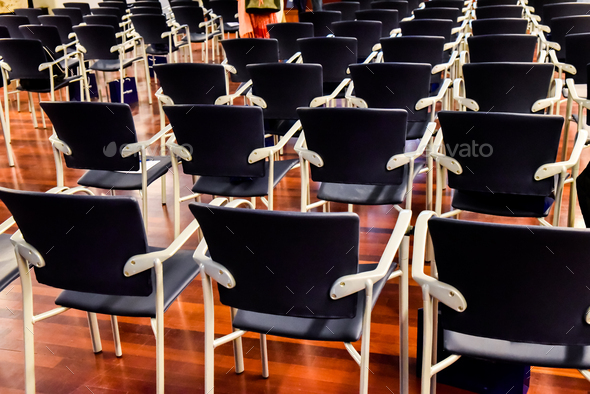 Row of empty chairs in a university class.