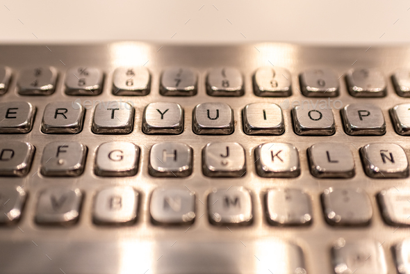 Metallic keyboard with letters and numbers to enter information in a cashier.