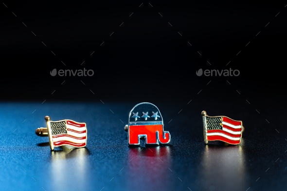 Emblem of the american republican party, an elephant, between two flags USA, isolated on black