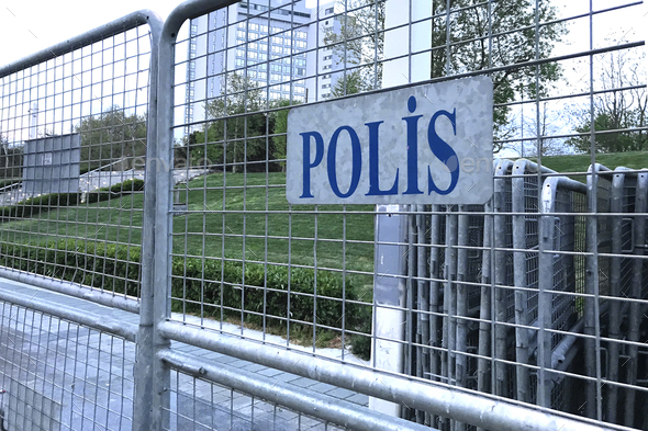 sign police in turkish language on mettalic borders barricades