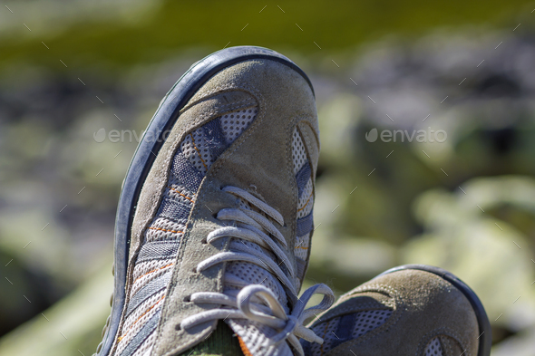 Close-up top view of pair of old worn comfortable men's classic white sneakers - Stock Photo - Images