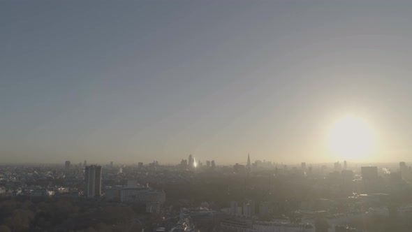 Sun shining brightly over the horizon over Knightsbridge London including Royal Albert Hall alt