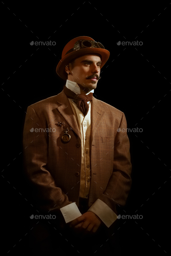 Portrait of steampunk man in hat and glasses