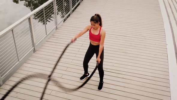 Aerial shot of a woman working out in the park alt