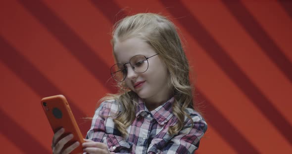 Girl Taking a Selfie with a Cell Phone alt