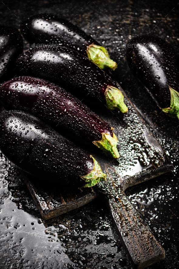 Ripe eggplant with droplets of water.