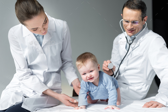 Pediatricians Trying To Check Breath Of Sad Baby Stock Photo By ...