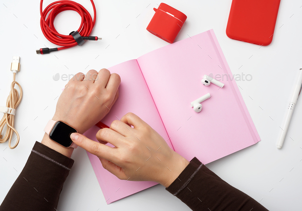 Smart watch with a blank black screen is on his left hand Stock