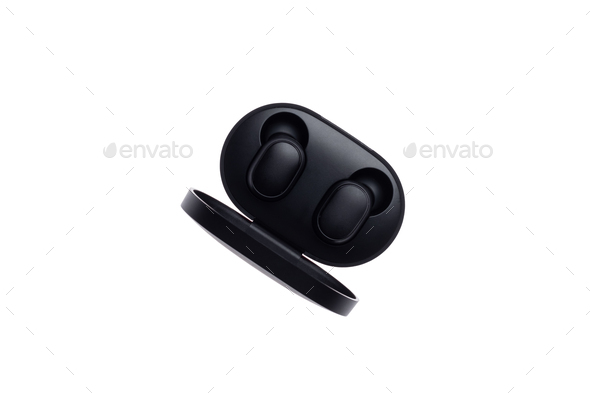 Wireless black bluetooth earphones with contactless charging isolated on a white