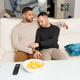 Gay couple chilling on sofa at home - PhotoDune Item for Sale