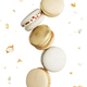 Isolated white, yellow, gold macaron cookies falling in the air - PhotoDune Item for Sale