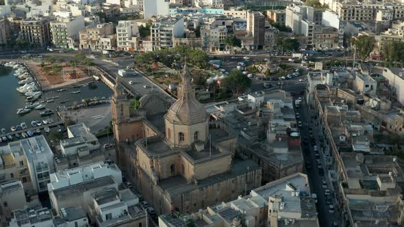 Majestic Beautiful Brown Catholic Church in Msida Town, Malta From Aerial Drone Perspective alt
