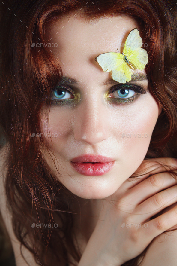 Portrait Of Tender Girl With Butterflies On Her Face And Body Stock
