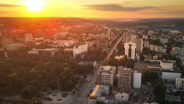 Aerial drone view of Chisinau downtown at sunset. Panorama view of multiple buildings, Parliament, P alt