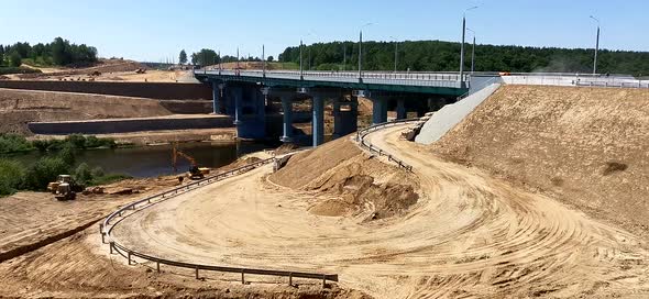 Earthworks During the Construction of a Road Bridge Over the River