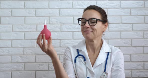 Medical work with enema.  alt