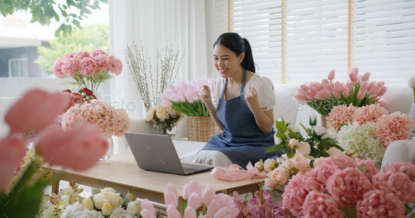 SME owner modern small flower shop work at home office happy