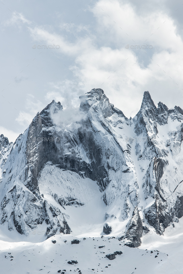 Granite mountains with snow - Stock Photo - Images