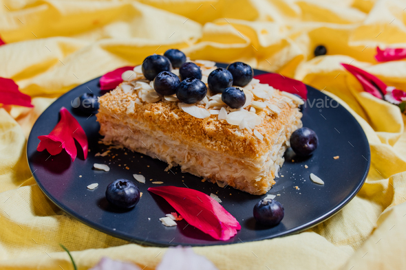 slice of vegetarian cake on yellow background, top view,