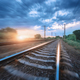 Railroad and cloudy blue sky at sunset with motion blur effect - PhotoDune Item for Sale