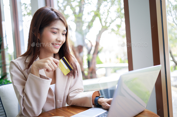 Businesswoman using credit card during payments shopping online. smart woman and business concept