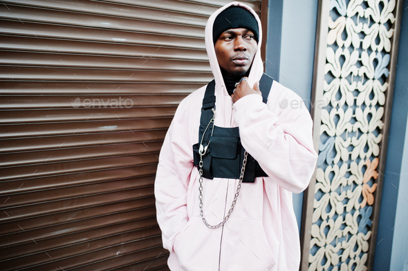 Stylish urban style african american man in pink hoodie