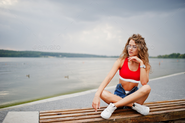 Sexy curly model girl in red top Stock Photo by ASphotostudio | PhotoDune