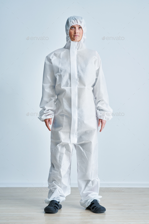 Woman in bio-hazard suit on white background.