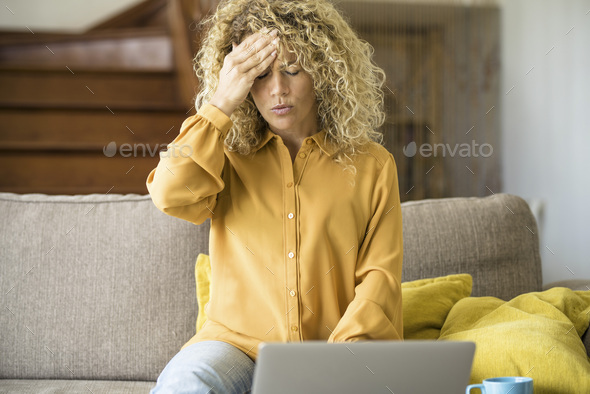 Overwork and stress bad health condition. Adult woman touching his front and head with pain