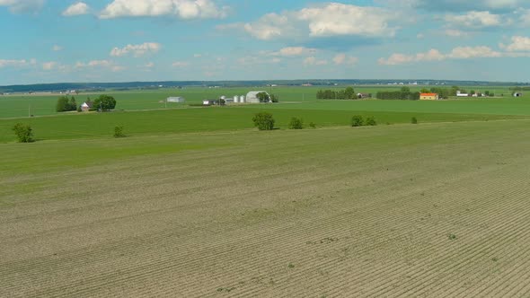 Farmlands in a rural area of Canada, aerial stock footage.
