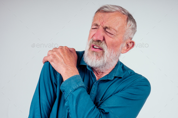 sick old man has pain in neck shoulder dislocation strong pain isolated white studio background