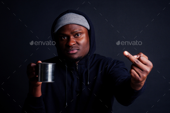 sad look african american man holding metal tourist thermos cup bad feeling.