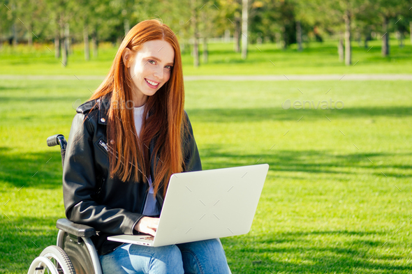 redhaired ginger business woman feeing happy,she sitting wheelchair - Stock Photo - Images