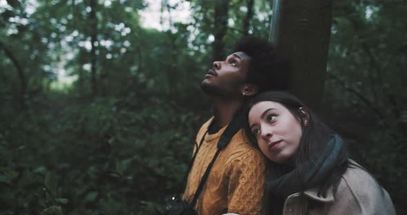 Man and woman have a cup of hot drink  alt