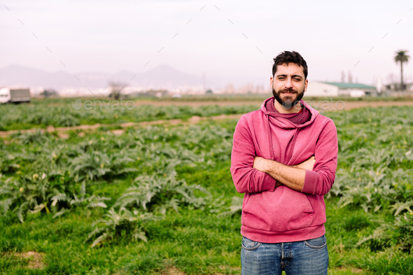 young entrepreneur farmer in front of a farm field