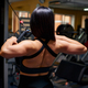 Sports woman in the gym shows the muscles - PhotoDune Item for Sale