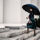 Young woman under an umbrella walking the stair - PhotoDune Item for Sale