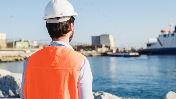 Naval engineer quality check in the port in a city near the ocean - Stock Photo - Images