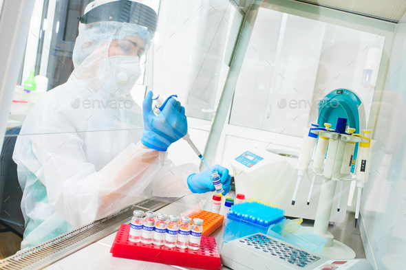 PCR lab worker creates a vaccine against covid-19 coronavirus infection.