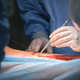Team of professional doctors operating a patient conducting open cut surgery - PhotoDune Item for Sale