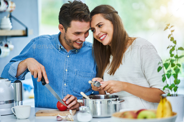 Adult couple cooking together at home Stock Photo by macniak | PhotoDune