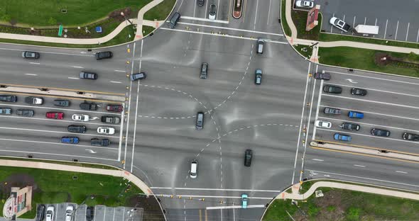 Travel traffic patterns in busy intersection. Cars and multilane highway road meetings at traffic li alt