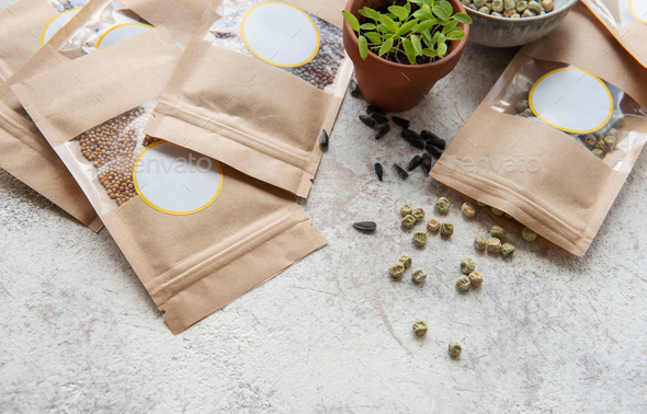 Microgreen seeds in paper bags and equipment for sowing microgreens.