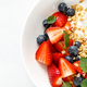 Breakfast bowl with granola, plain yogurt, strawberry and blueberry. Top view. Banner - PhotoDune Item for Sale