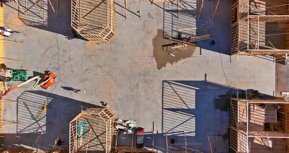 Construction of a Wooden Beam Roof Framing Truss System From an Aerial View alt