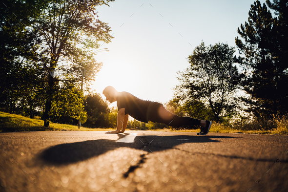Man do push-ups at the street, Crossfit man and lifestyle concept.