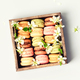 French Macaroons in wooden box with spring flowers flat lay - PhotoDune Item for Sale