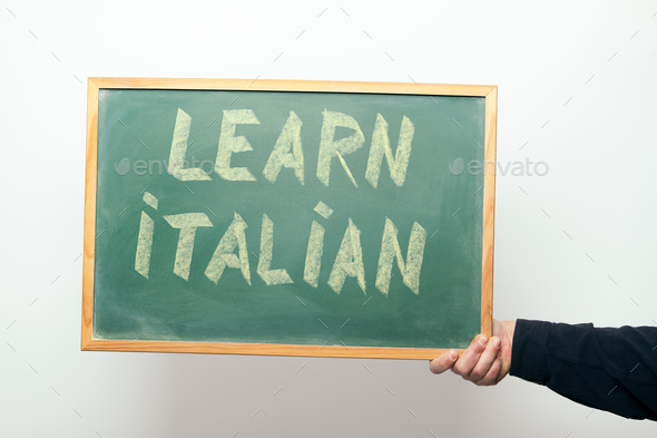 chalkboard with LEARN ITALIAN handwritten in chalk