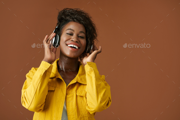 Woman Listening to Radio in Headphones