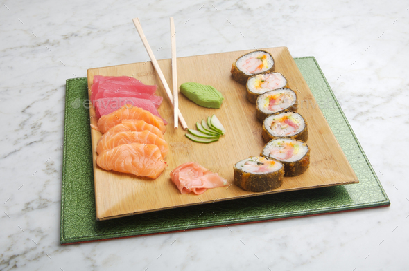 dish with sushi roles on marble table - Stock Photo - Images